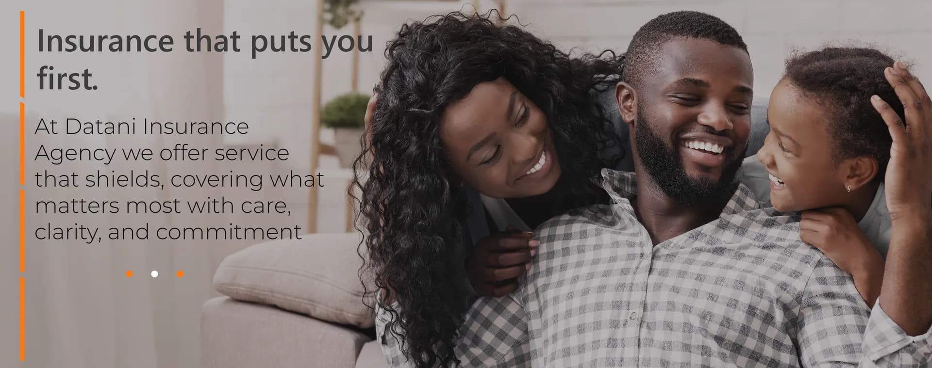 A happy family relaxing together at home, protected by Datani Insurance Agency
